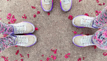 a person's legs and feet in colorful socks