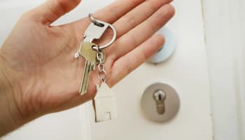 a hand holding a key chain