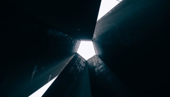 a black structure with a white sky