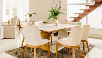 a table with chairs in a room