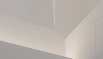 a white wall with a white shelf