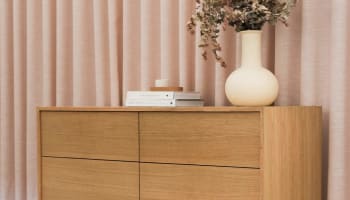 a vase with dried flowers in it