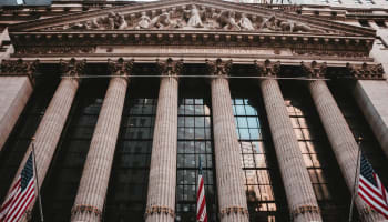 a building with columns and a flag