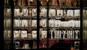 a display of jewelry on a shelf