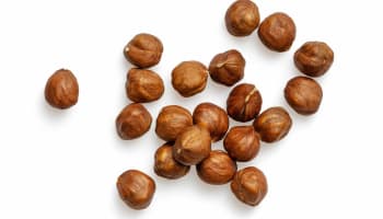 a group of hazelnuts on a white background