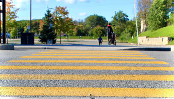 a person walking on a crosswalk