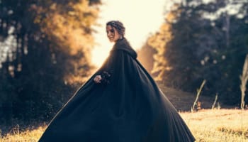 a person in a black cape