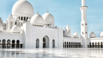 a large white building with domes