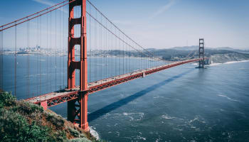 Golden Gate Bridge over water with cars on it