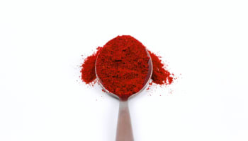 a spoonful of red powder