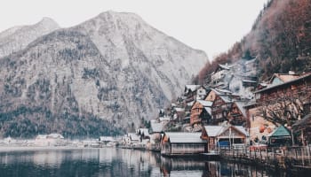 a mountain and a lake with houses