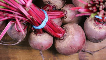 a bunch of beets with a rubber band