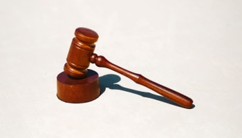 a wooden gavel on a stand