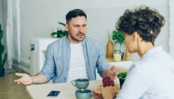 two people sitting at a table