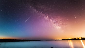 a starry sky over water