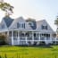 a house with a porch and a lawn