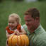 a person holding a child in his arms