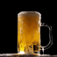 a glass of beer with foam