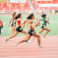 a group of women running on a track