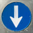a blue sign with a white arrow