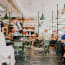 a group of people sitting at tables in a restaurant