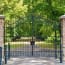 a gate with trees in the background