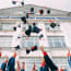 a group of people throwing graduation caps in the air