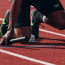 a person in a track with a baton