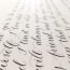 a close up of a paper with calligraphy