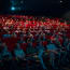 a group of people sitting in a movie theater