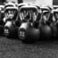 a group of kettlebells on a floor