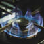 a blue flame on a stove