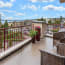 a balcony with a view of a city and water