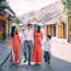 a group of people walking on a street