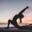 a person doing yoga on a dock