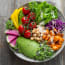 a bowl of food on a wood surface