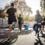 a group of people running on a street