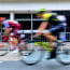 a blurry image of a group of cyclists