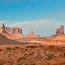 a desert landscape with tall rock formations
