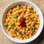 a bowl of chickpeas with a chili pepper