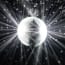 a disco ball with light rays