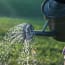 a watering can with water coming out of it