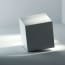 a white cube with a light shining on it