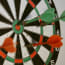 a dart board with arrows in the center