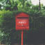 a red mailbox with white text