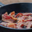 bacon cooking in a pan