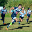 a group of men playing rugby