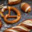 a pretzel and bread on a table