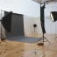 a photo studio with a large screen