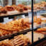 a display case with different types of bread